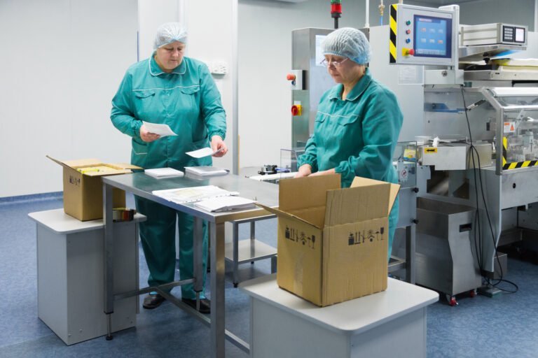 Pharmaceutical factory workers in sterile environment